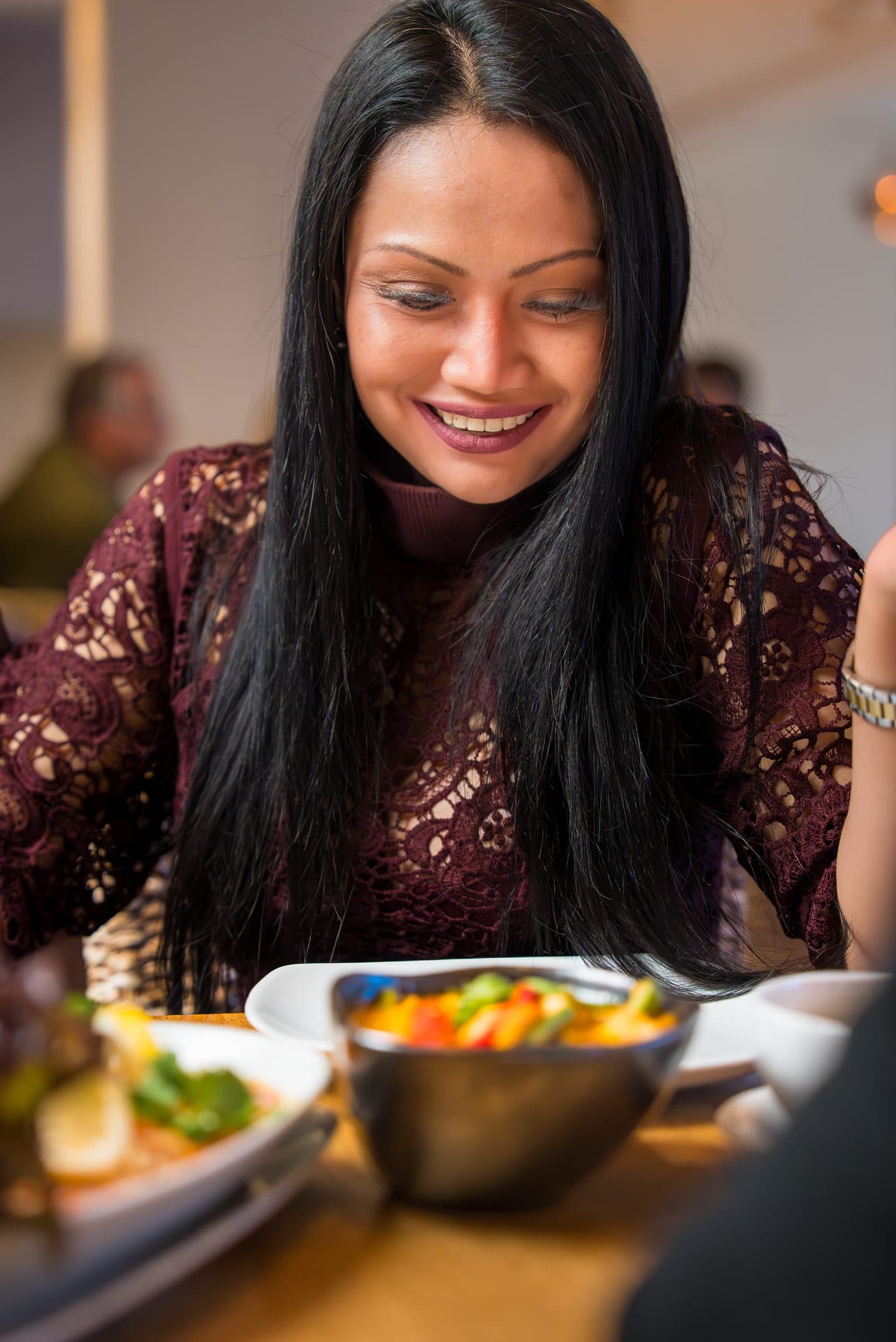 Guest enjoying vegetable Thai dishes at Tiien Thai